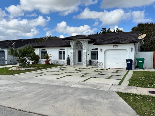 mediterranean / spanish house featuring a garage