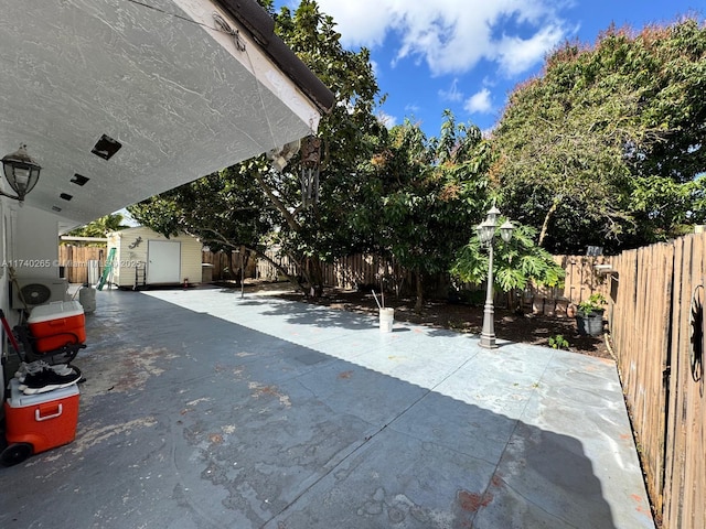 view of patio / terrace with a storage shed