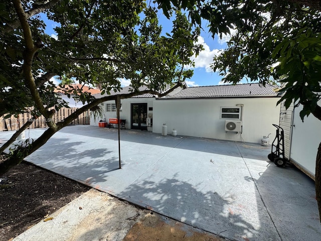 rear view of property with a patio area