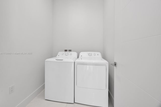 clothes washing area with washing machine and clothes dryer