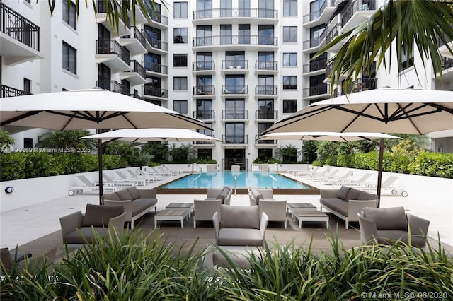 view of pool with a patio and an outdoor hangout area