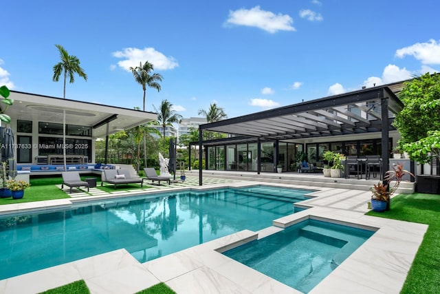 view of swimming pool featuring outdoor lounge area, a patio, and an in ground hot tub