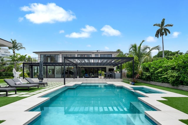 view of swimming pool featuring a pergola, a patio area, and an in ground hot tub