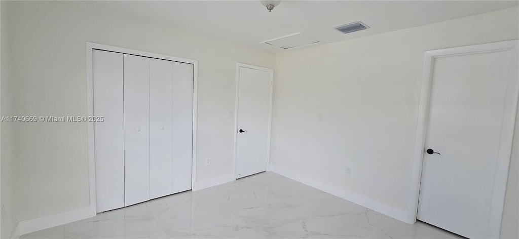 unfurnished bedroom featuring a closet