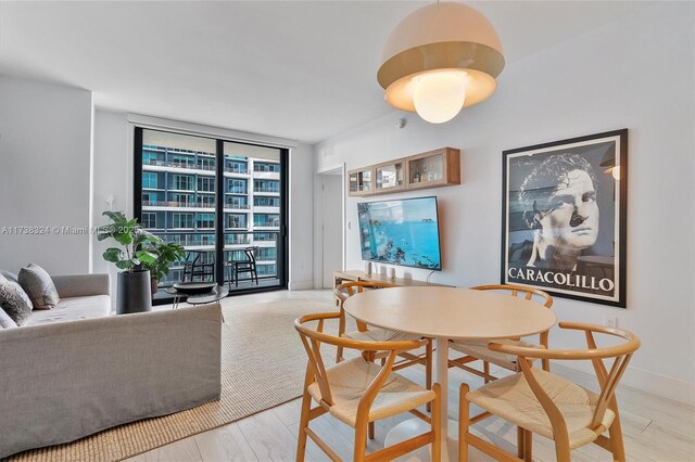 1300 S Miami Ave Unit 3408, Miami, FL 33130 - dining room with floor to ceiling windows and wood finished floors