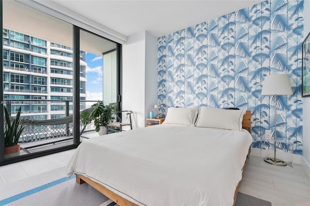 bedroom with floor to ceiling windows