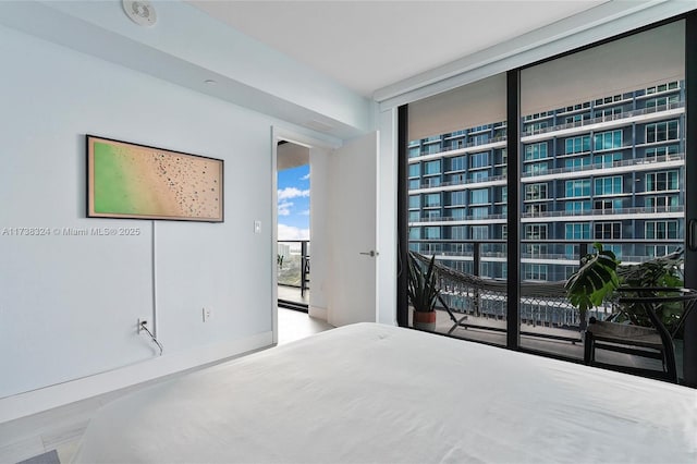 bedroom with floor to ceiling windows