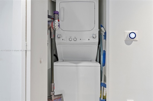 laundry room featuring stacked washer / dryer