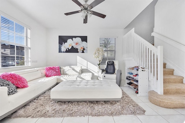 tiled living room featuring ceiling fan