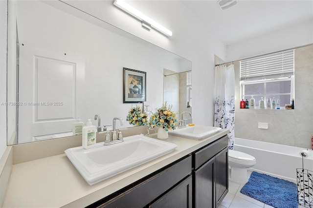 full bathroom with shower / tub combo, vanity, tile patterned flooring, and toilet