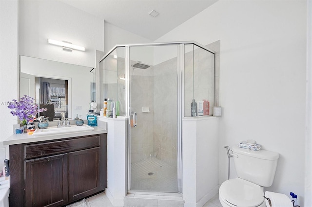 bathroom with vanity, tile patterned flooring, a shower with shower door, and toilet