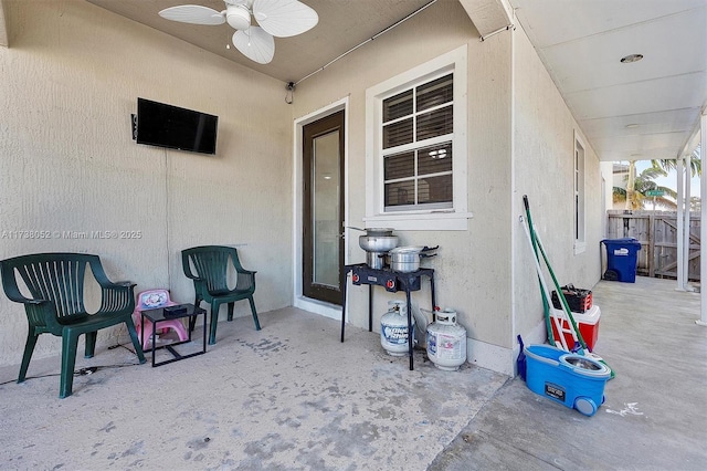 view of patio / terrace featuring ceiling fan