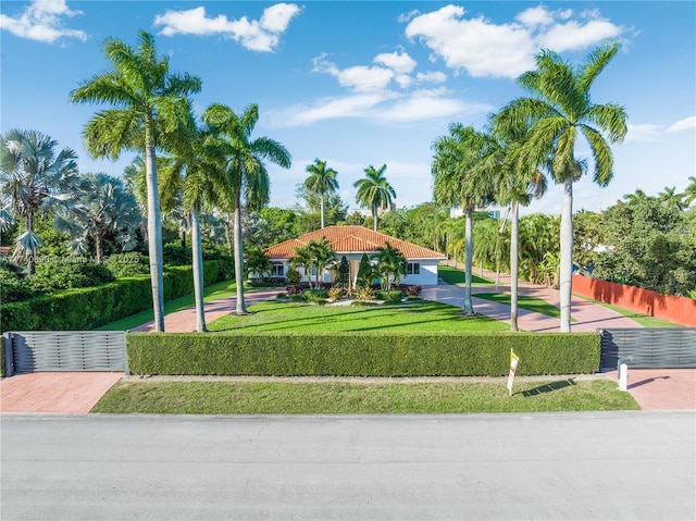 view of property's community with a lawn