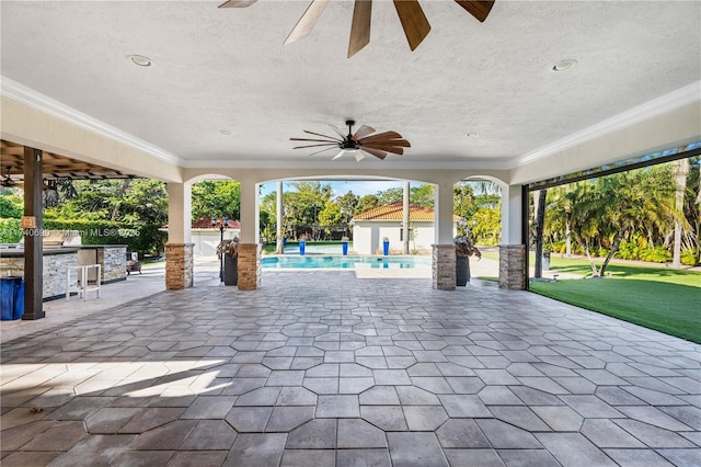 view of patio / terrace with ceiling fan and an outdoor bar