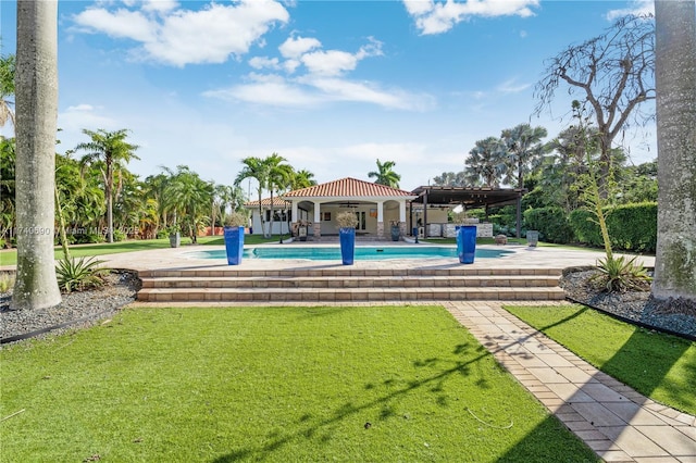 view of pool featuring ceiling fan, a yard, a pergola, and a patio area