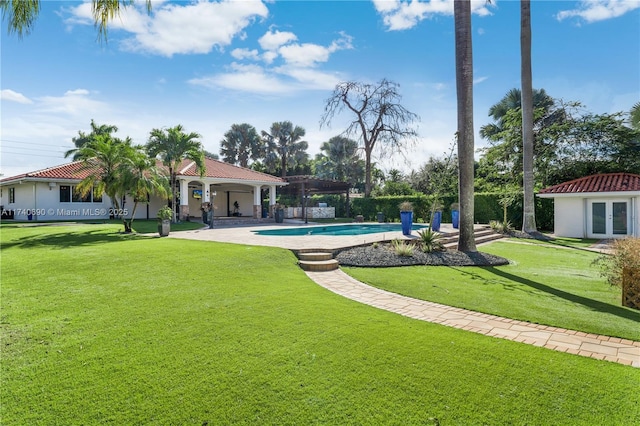 view of swimming pool with a yard, a patio area, and a pergola