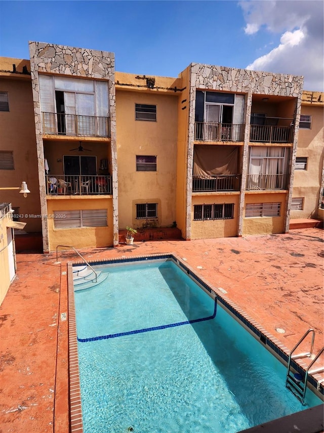 view of pool featuring a patio area