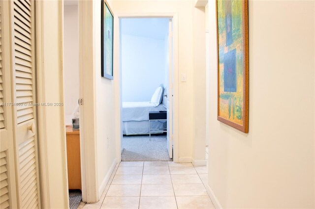 9064 SW 113th Ave, Miami, FL 33176 - corridor featuring light tile patterned floors, baseboards, and light colored carpet