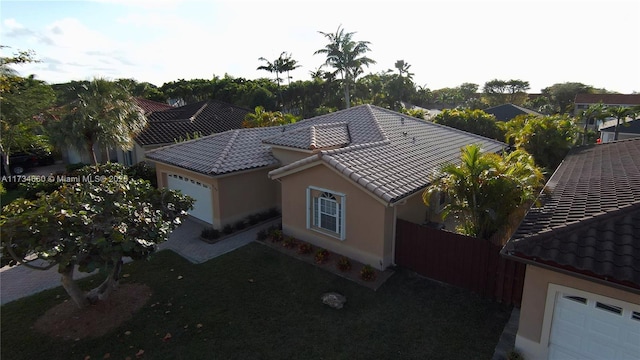 9064 SW 113th Ave, Miami, FL 33176 - view of property exterior with fence, stucco siding, and a tiled roof