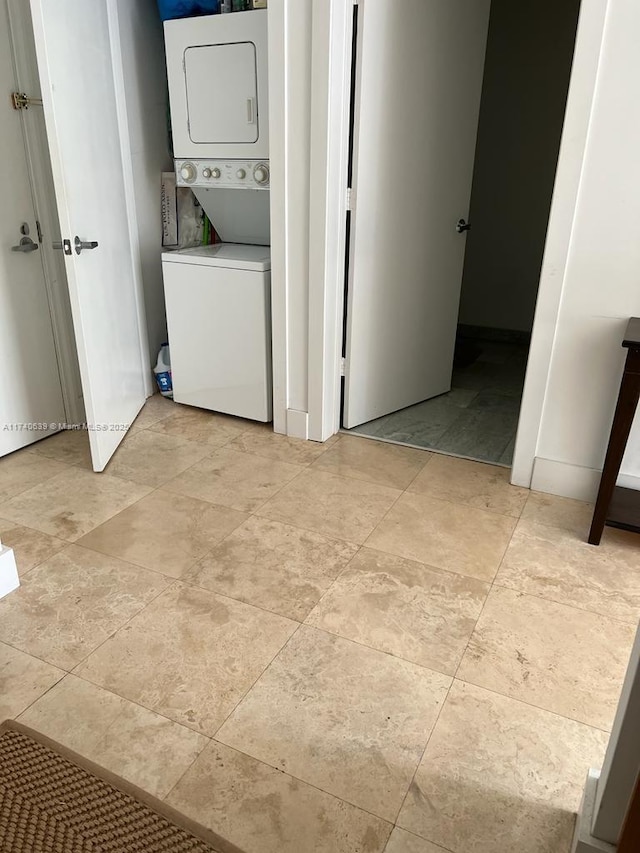 washroom featuring stacked washer and dryer