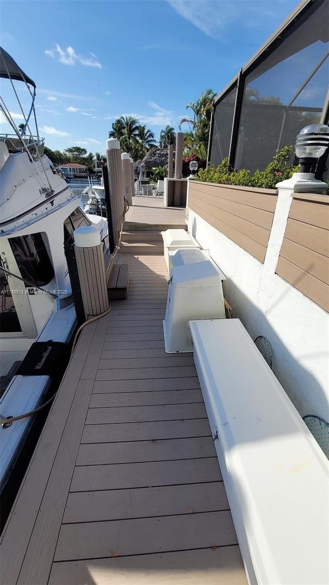 wooden deck with a lanai