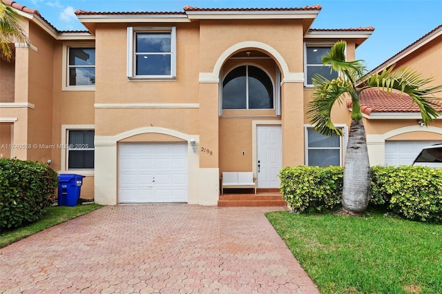 view of front of property with a garage