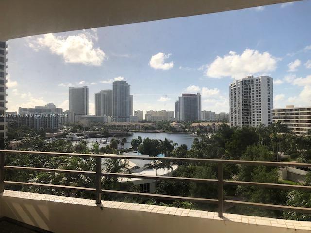 balcony featuring a water view