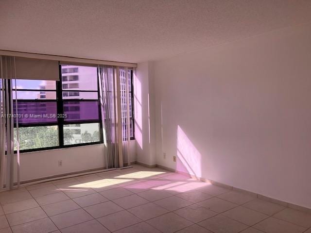 spare room featuring a textured ceiling