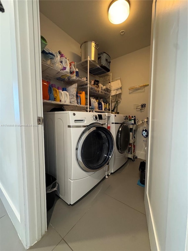 washroom with independent washer and dryer