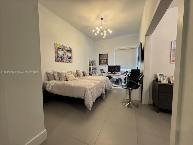 bedroom featuring light tile patterned floors and an inviting chandelier