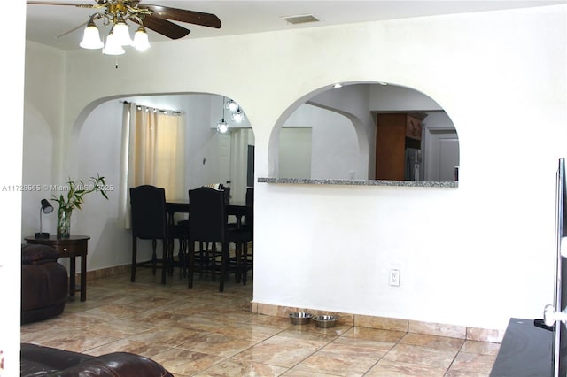 interior space featuring ceiling fan