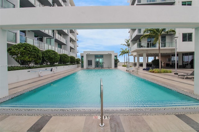 view of swimming pool featuring a patio area