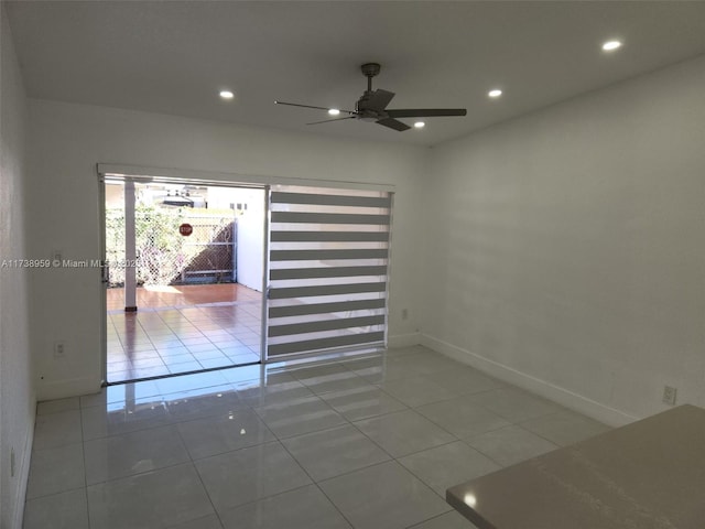 unfurnished room with tile patterned flooring and ceiling fan