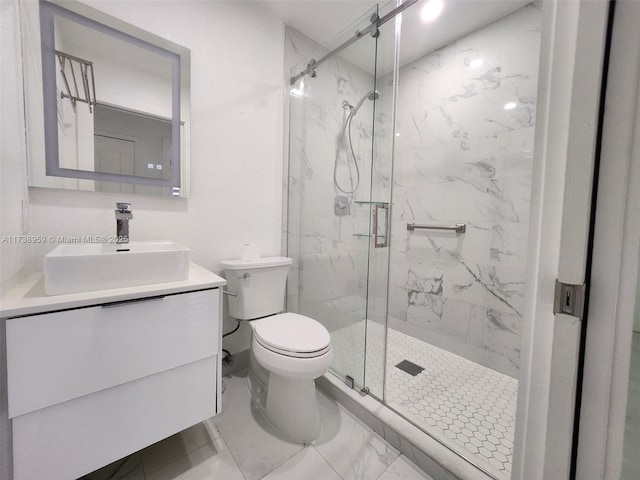 bathroom with vanity, toilet, and a shower with door