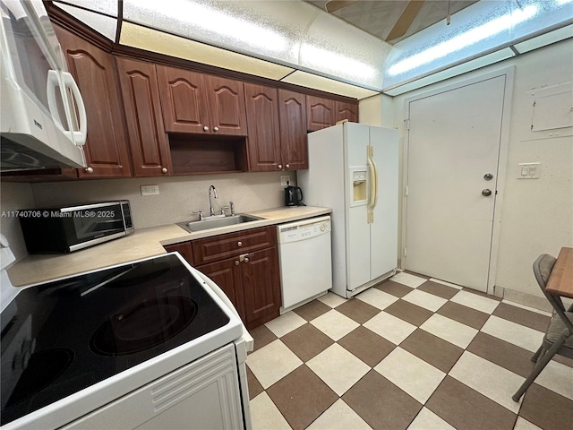 kitchen featuring sink and white appliances