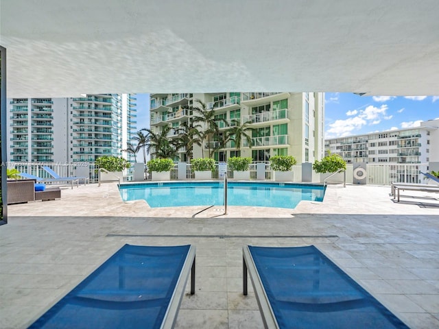 view of swimming pool featuring a patio