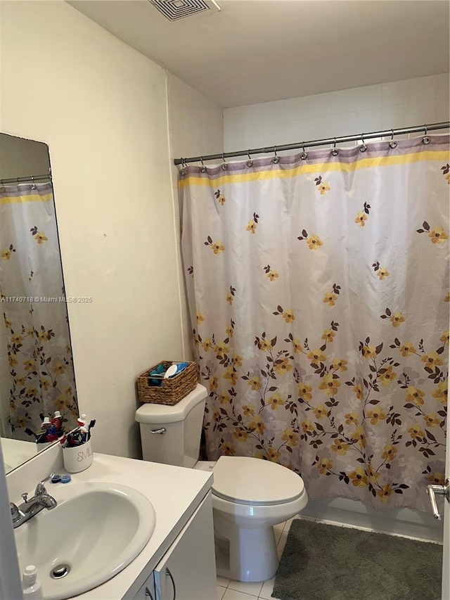 full bathroom featuring shower / bathtub combination with curtain, vanity, toilet, and tile patterned flooring