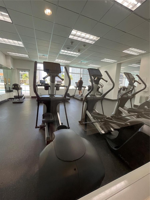 gym featuring a drop ceiling