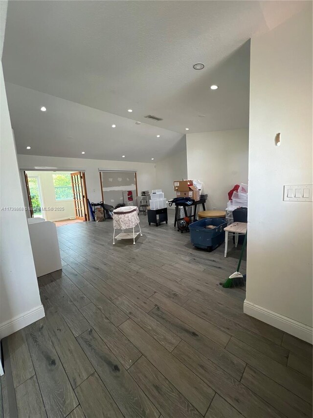 laundry room featuring hardwood / wood-style flooring and separate washer and dryer