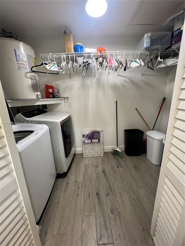 bathroom featuring hardwood / wood-style flooring, vanity, toilet, and a tub