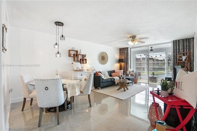 dining room with a textured ceiling and ceiling fan