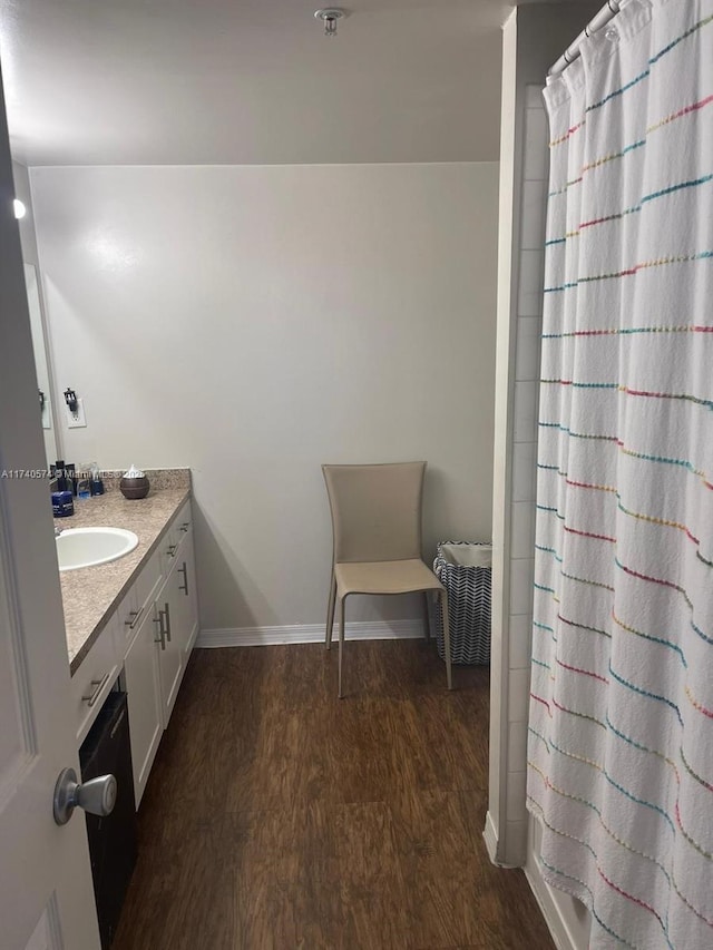 bathroom with vanity, wood-type flooring, and a shower with shower curtain