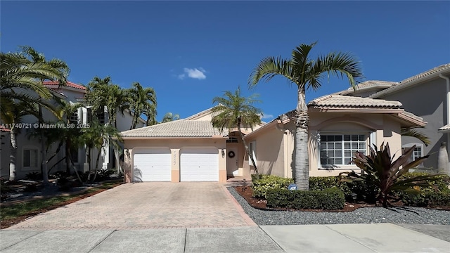 mediterranean / spanish house featuring a garage