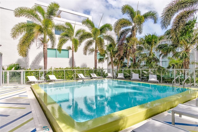 view of swimming pool with a patio area