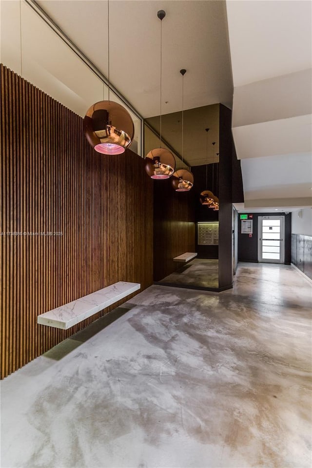 garage featuring wooden walls