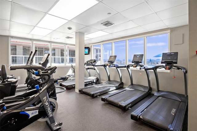 exercise room with a drop ceiling