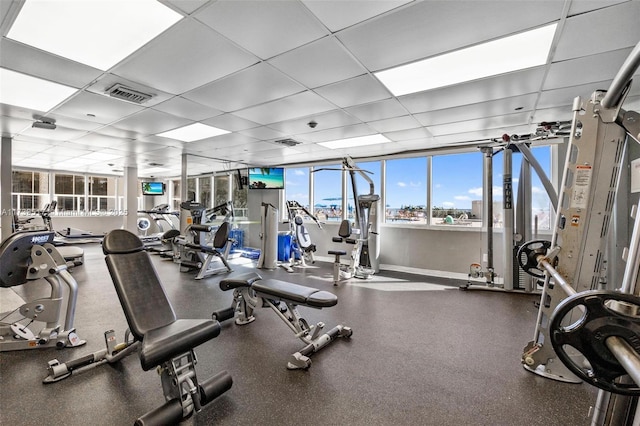 gym featuring a drop ceiling