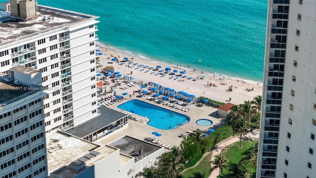 aerial view featuring a view of the beach and a water view