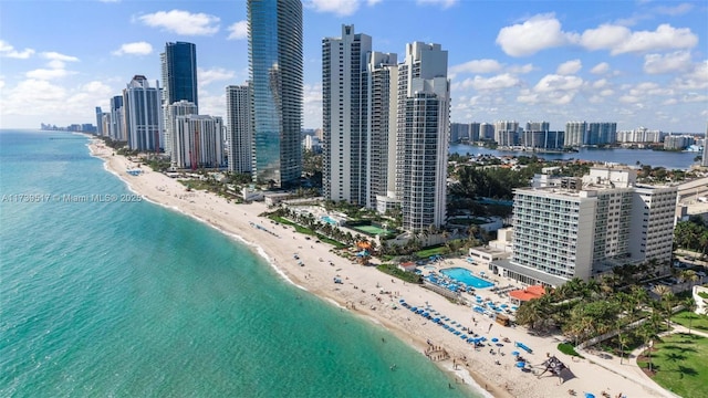 aerial view featuring a water view and a beach view