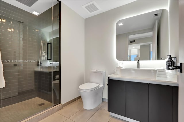 bathroom with an enclosed shower, vanity, tile patterned floors, and toilet